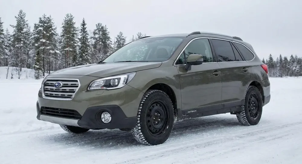Subaru Outback Outfitted With Black Steel Wheels And Winter Tires
