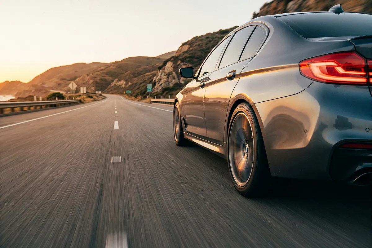 Performance Car on Highway with W-Rated Tires