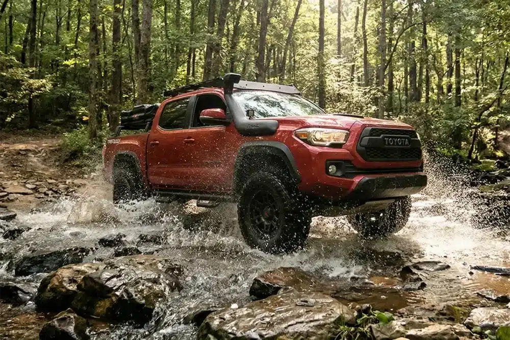 AT vs RT Tires: What Is Rugged Terrain? 5 Toyota Tacoma with rugged terrain tires