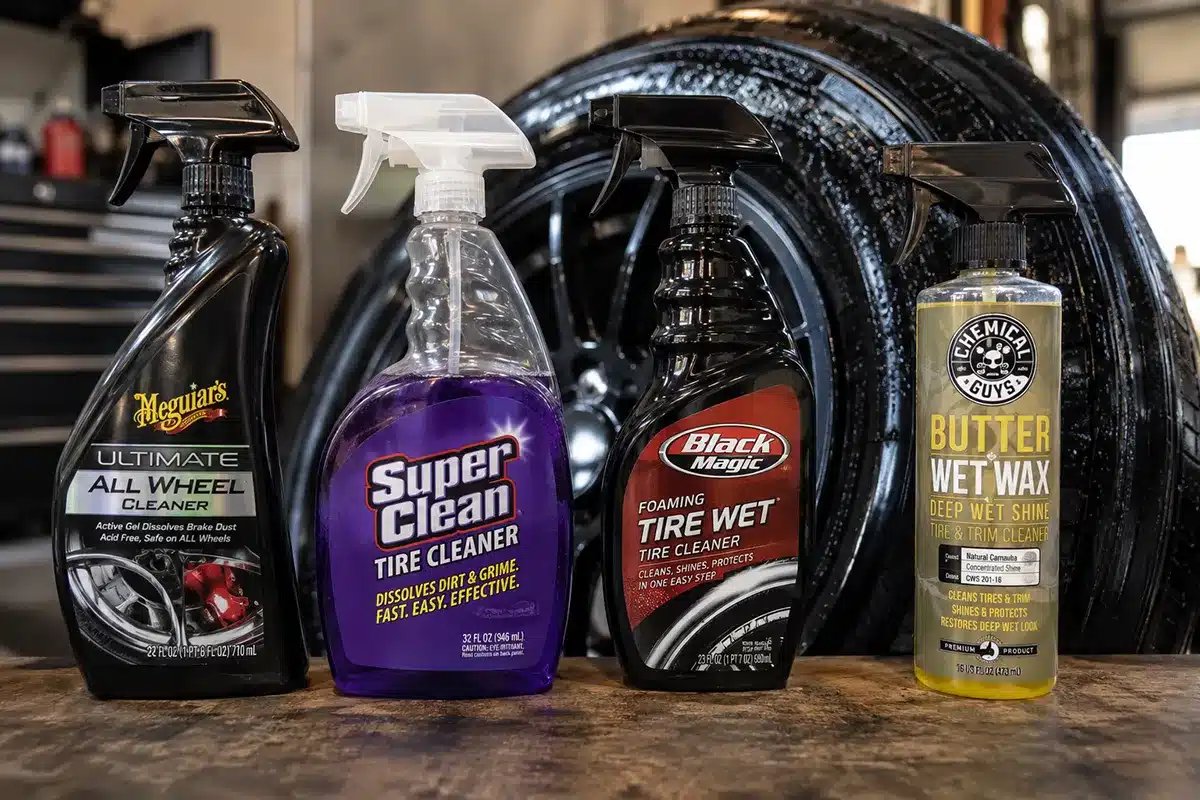 11 Best Cleaner for Tires in 2026 - Tested & Ranked by a Tire Nerd 3 Best tire cleaner products lined up on a garage workbench next to a clean black tire